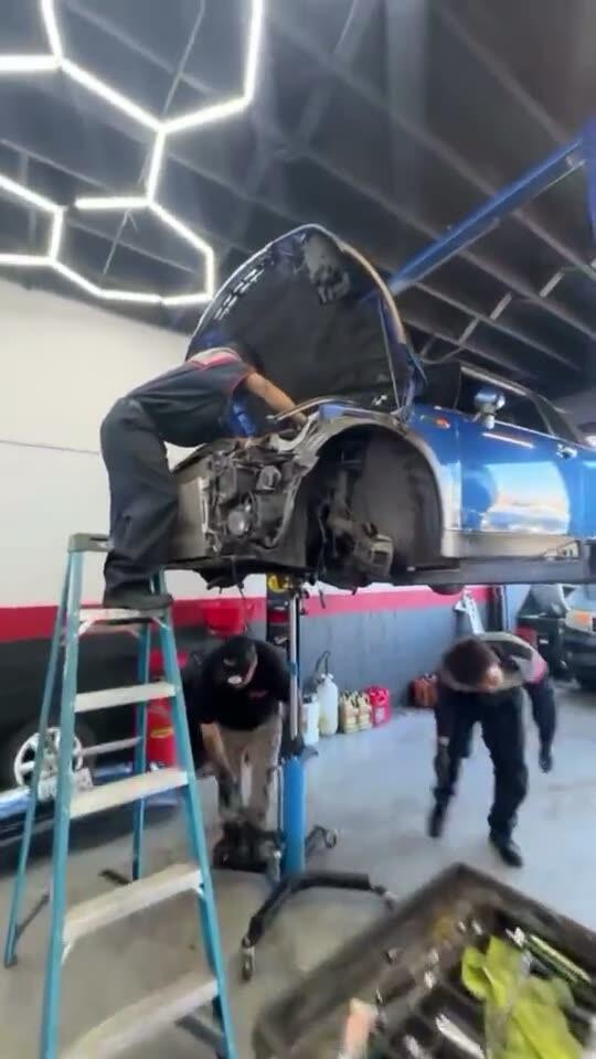 Mini Cooper on the lift with the front end off